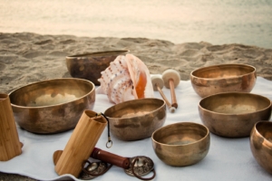 Meditation on the beach with Tibetan Singing bowls, Koshii and Tibetan tingshas. Balance and harmony.